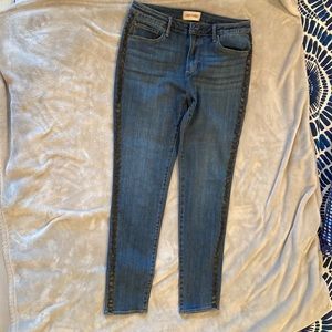 DRIFTWOOD jeans dark wash with star leather look embellishments on outside seams